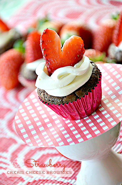 Valentine's Day Recipes - Mouth watering brownies topped with a light homemade cream cheese topping and fresh strawberries. SO GOOD! PIN IT NOW and make them later! 