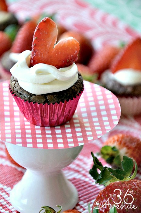 Mouth watering brownies topped with a light homemade cream cheese topping and fresh strawberries. SO GOOD! the36thavenue.com #recipe