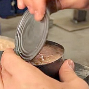 Clever Ideas - How to open a can without a can opener or any tools!