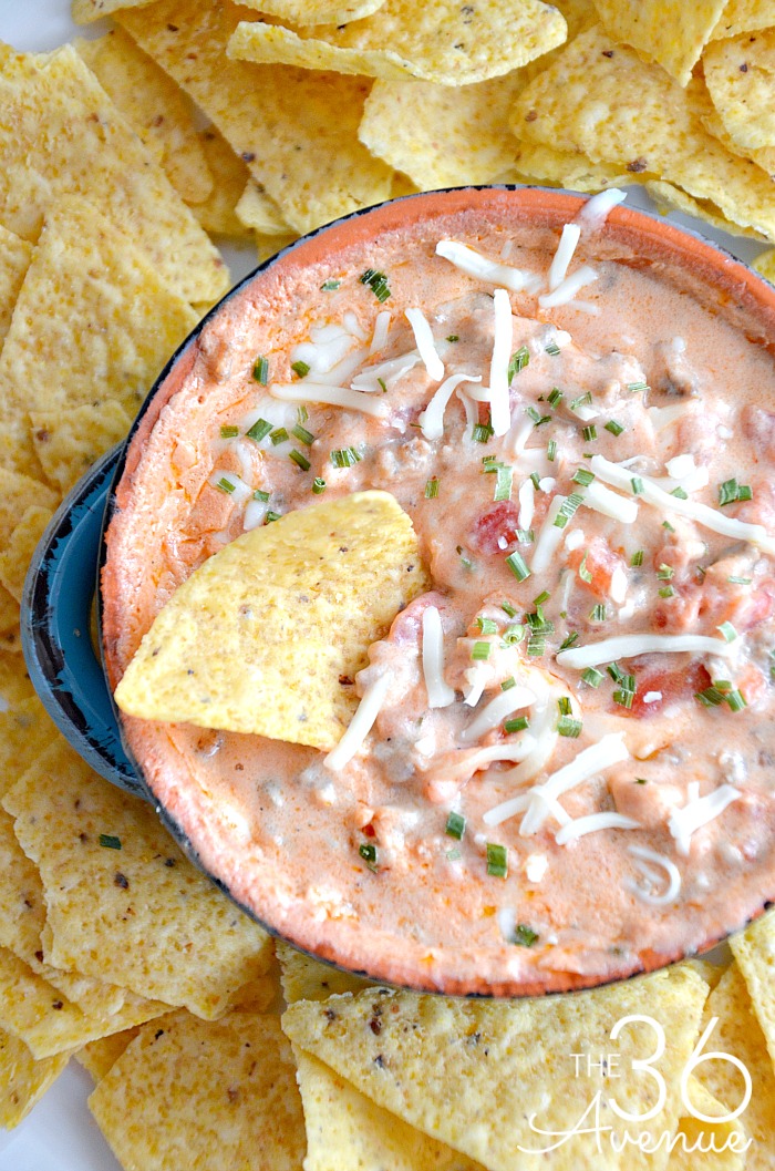 Cheese Sausage Dip Recipe - This easy slow cooker dip recipe is the perfect appetizer for any party. We love to serve it with tortilla chips or crackers.  An easy slow cooker recipe that you want to pin for later! 