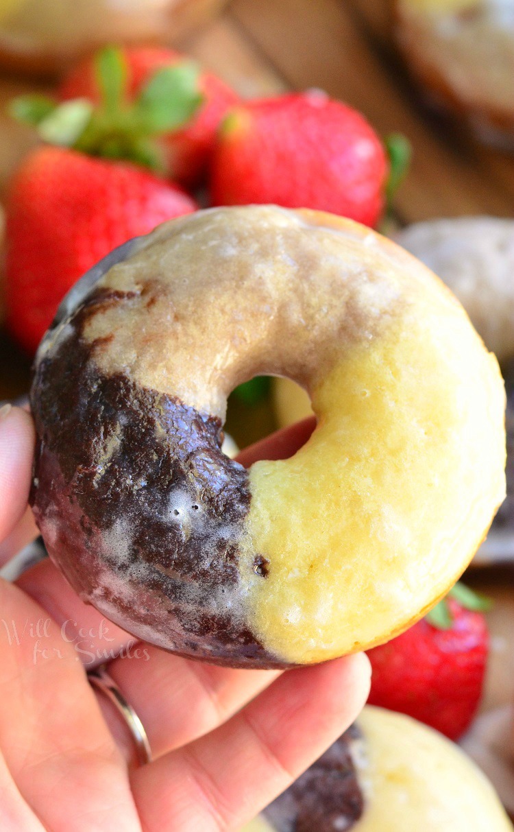 Neapolitan Doughnuts - Soft, moist, cake-like baked doughnuts inspired by the Neapolitan ice cream and made with three layers of different flavor in one. These doughnuts have chocolate, vanilla and strawberry flavors in one doughnut and dipped in glaze as an extra sweet touch.